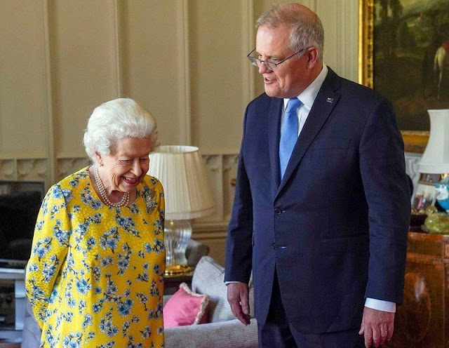 Queen Elizabeth wore a yellow and blue floral dress from  Stewart Parvin. The Queen opted to wear her Jardine Star Brooch