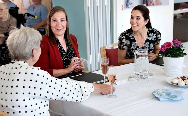 Crown Princess Mary wore a new floral wrap dress from Ralph Lauren, and Gianvito Rossi pumps, Dulong Esme bracelet, Cartier Love Bracelet