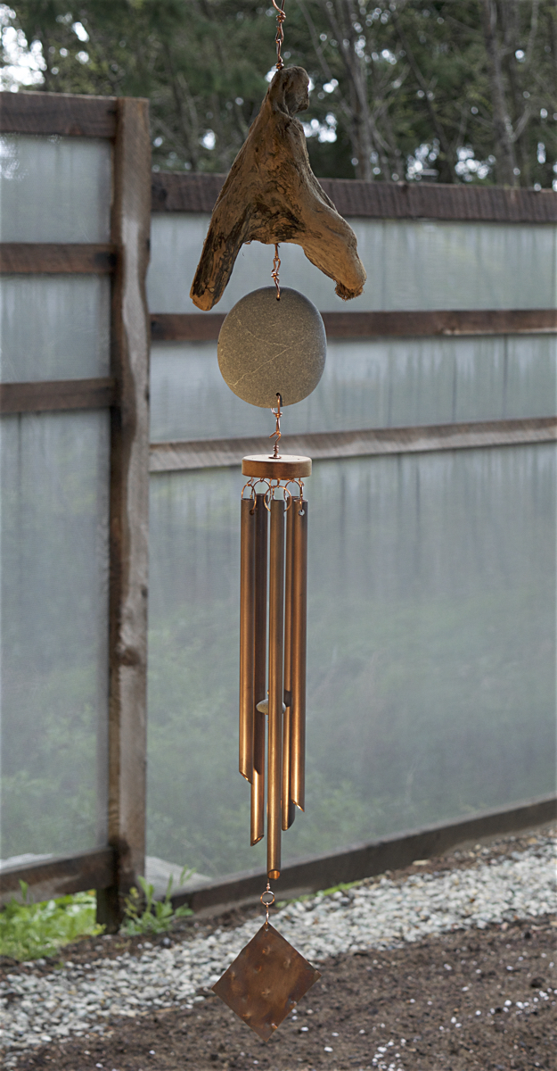 Natural Pacific beach stone and driftwood wind chime with five large copper chimes.