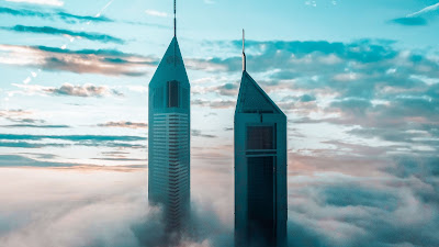 Wallpaper skyscrapers above the clouds