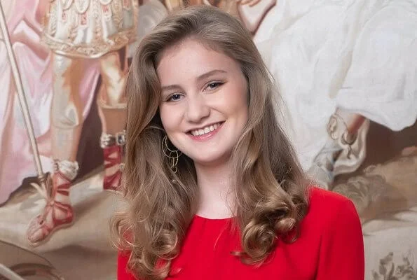 Crown Princess Elisabeth wearing bridesmaid blue v-neck chiffon maxi dress, Sandro  red dress, Zara sweater, Ole Lynggaard earrings