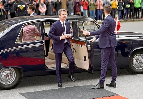 Queen Margrethe, Crown Prince Frederik and Princess Benedikte. Crown Princess Mary wore Claes Iversen coat