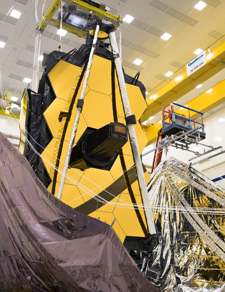 At the Northrop Grumman facility in Redondo Beach, California, technicians begin stowing the sunshield on NASA's James Webb Space Telescope...in preparation for its trip to its South American launch site this summer. At the Northrop Grumman facility in Redondo Beach, California, technicians begin stowing the sunshield on NASA's James Webb Space Telescope...in preparation for its trip to its South American launch site this summer.