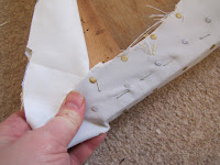 Step 1: Pull the fabric taut on the chair seat and staple.