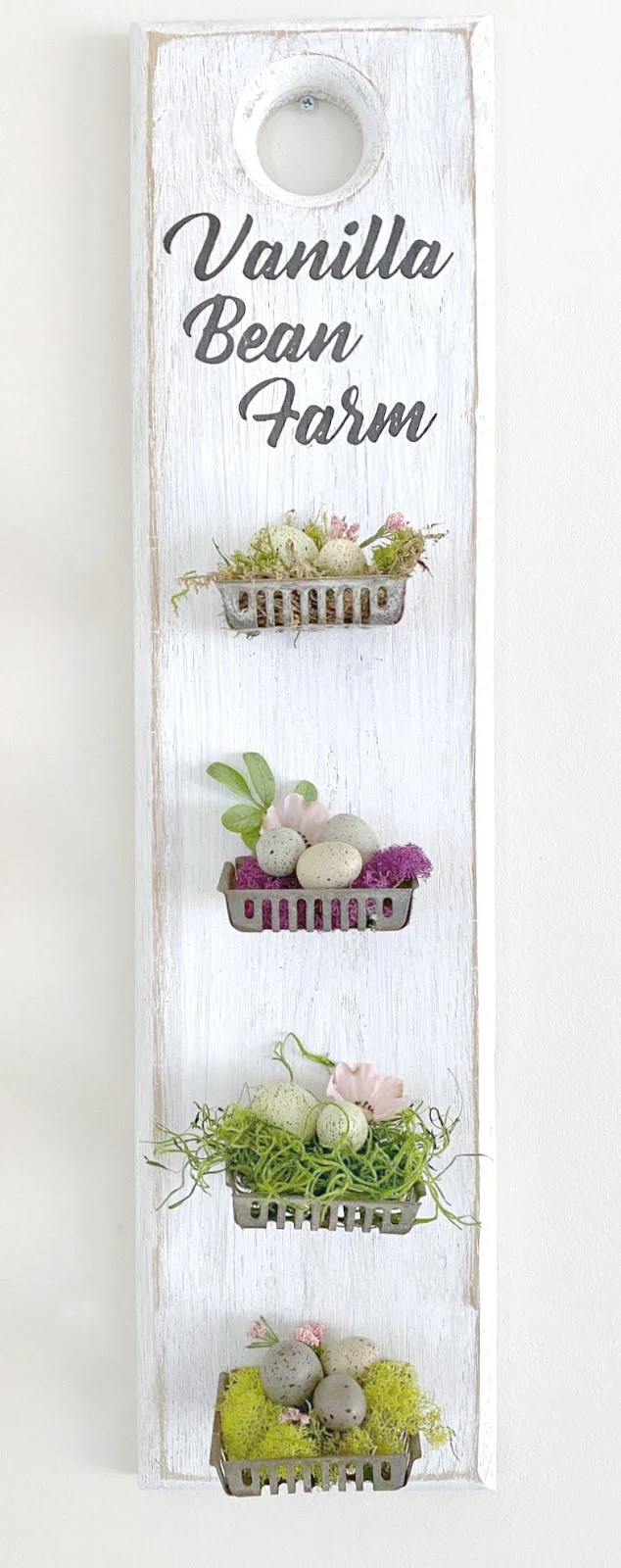 Repurposed metal soap basket nests and speckled eggs