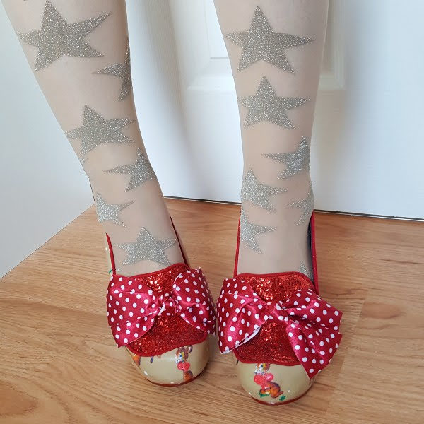 wearing Irregular Choice One Love polka dot bow and red glitter shoes with gold star tights