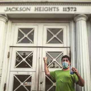 Greig Roselli Stands and Points to the Entrance of the Jackson Heights Post Office in Queens