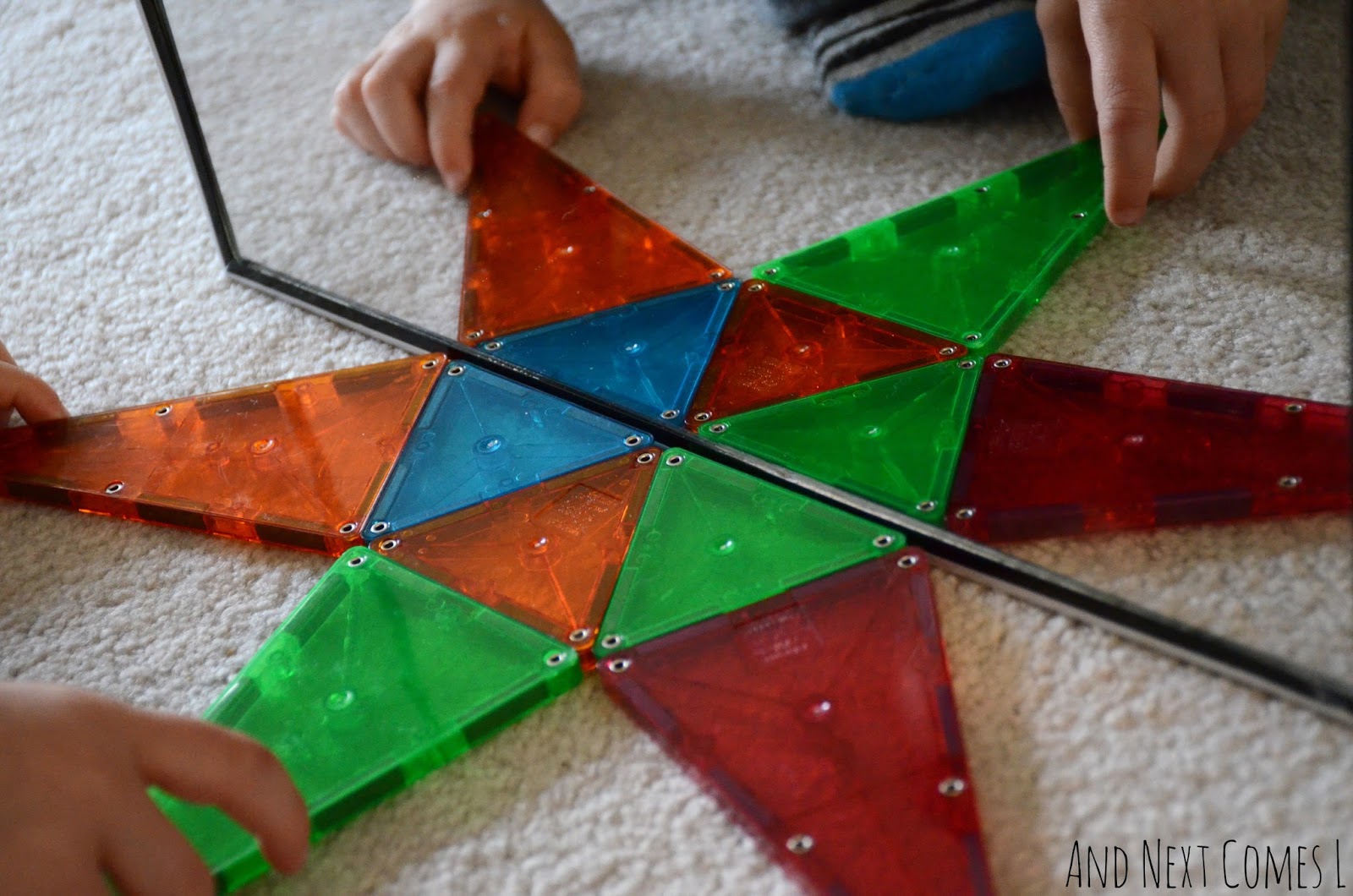 Exploring symmetry with mirrors and Magna-Tiles from And Next Comes L