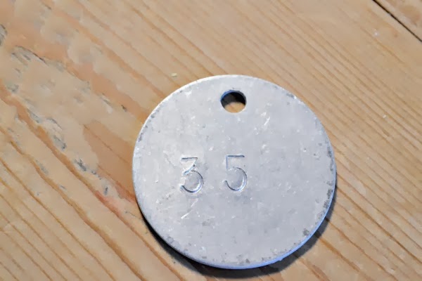 metal tag with number 35