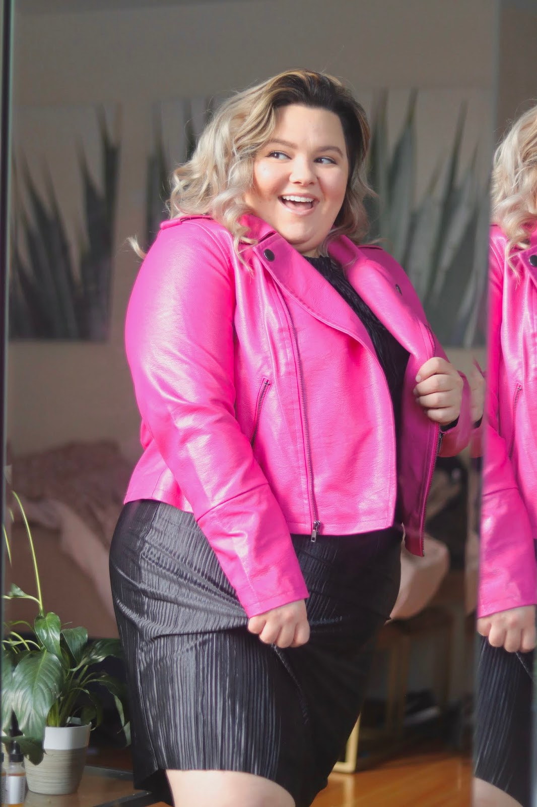 Chicago Plus Size Petite Fashion Blogger Natalie in the City reviews Eloquii's leather moto jacket.