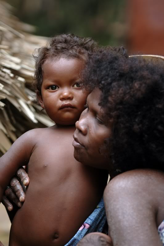 An Philippine Aeta woman holds her child.