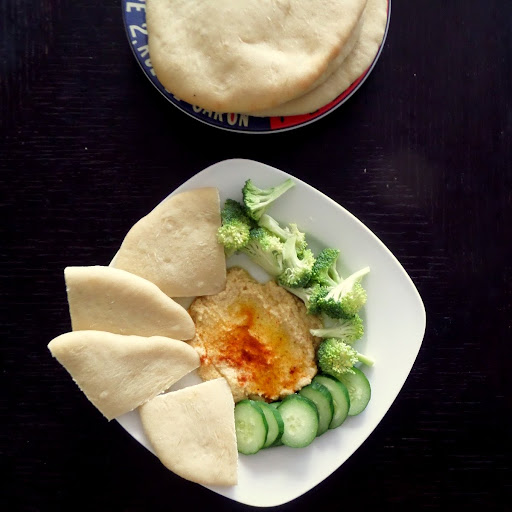 Hummus:  A creamy dip or spread made from chickpeas, tahini, lemon juice and olive oil.  Great with vegetables or pita.