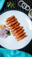 Serving Chicken seekh kabab pieces with green chutney onion ring and lemon for chicken seekh kabab recipe