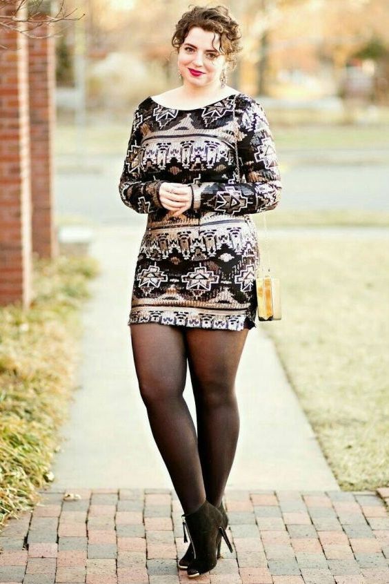 Beautiful curvy wearing booties and black tights