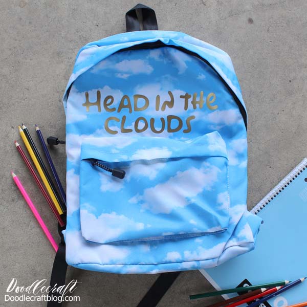 Personalize cloudy sky blue Backpack for Back-to-School with gold Cricut Iron-on vinyl that reads "head in the clouds" DIY