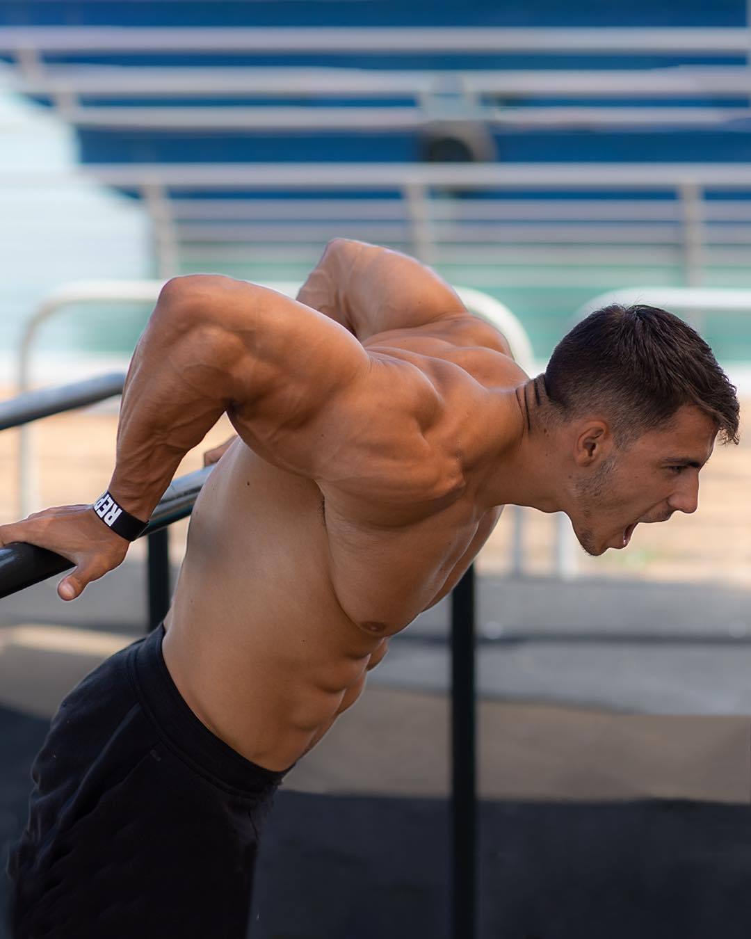 straight-masculine-young-mad-guy-outdoor-workout-biceps-huge-pecs-abs