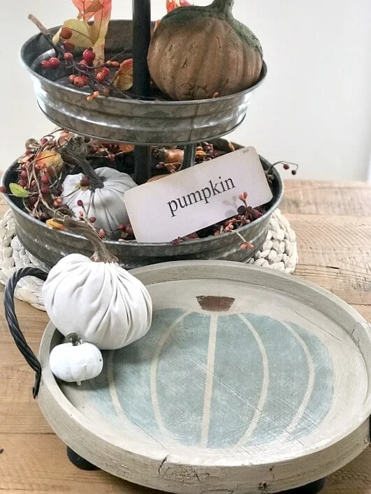 Tiered tray with fall decor and round white stenciled teal pumpkin tray