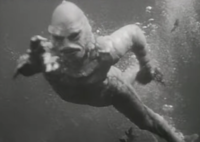 The creature from the black lagoon swimming under water.