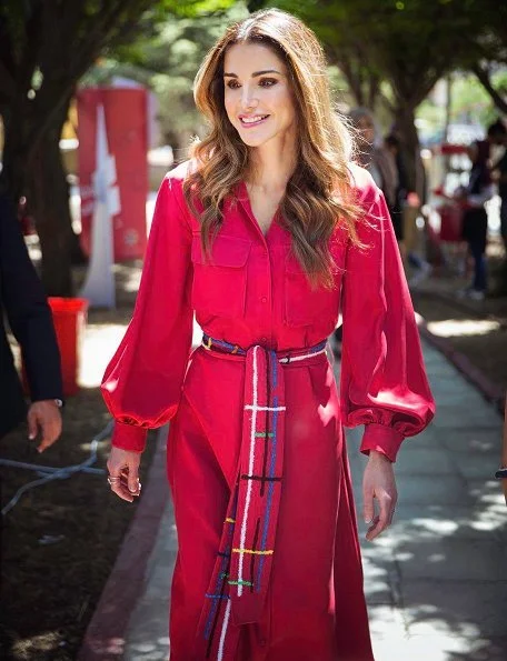 Queen Rania of Jordan visited Masahati Carnival organized by Madrasati initiative at Millennium Park in Amman. Queen wore red vintage belted shirt dress