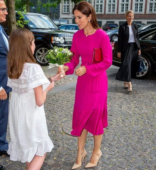 Crown Princess Mary wore No 21 long sleeve pleated midi dress, and carries Carlend Copenhagen Vanessa red clutch