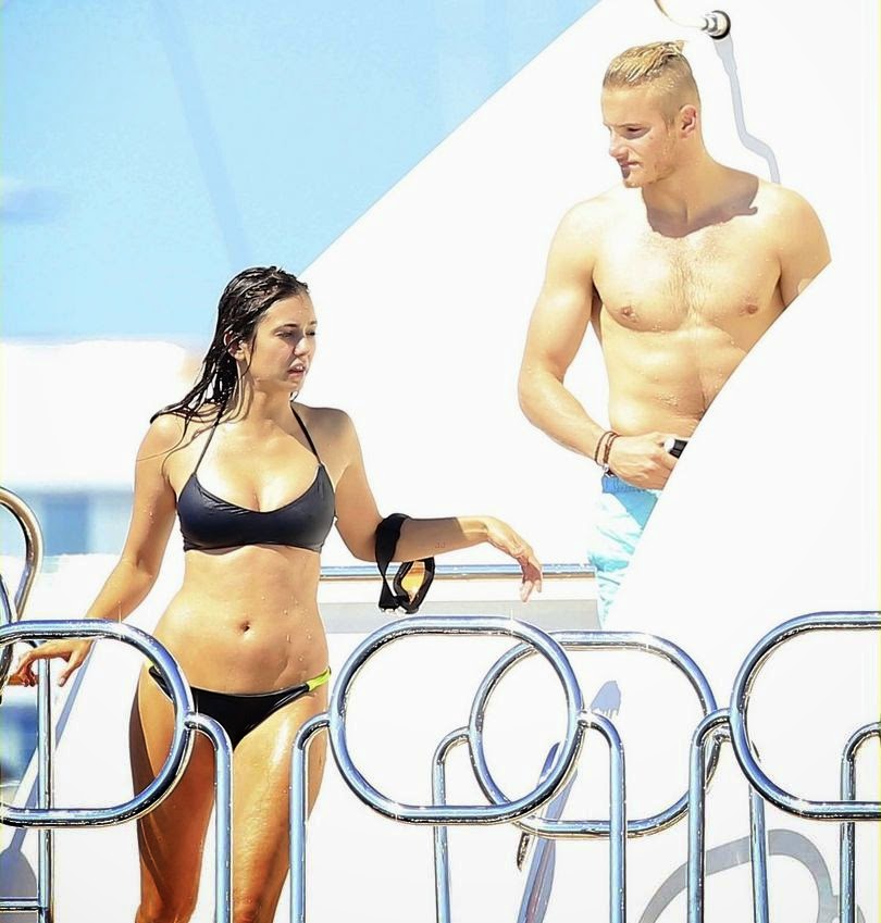 Nina Dobrev ordinarily displaying her amazing anatomy in a black bikini as she enjoying her vacation on a yacht with Alexader Ludwig in Ibiza on Friday, August 22, 2014.