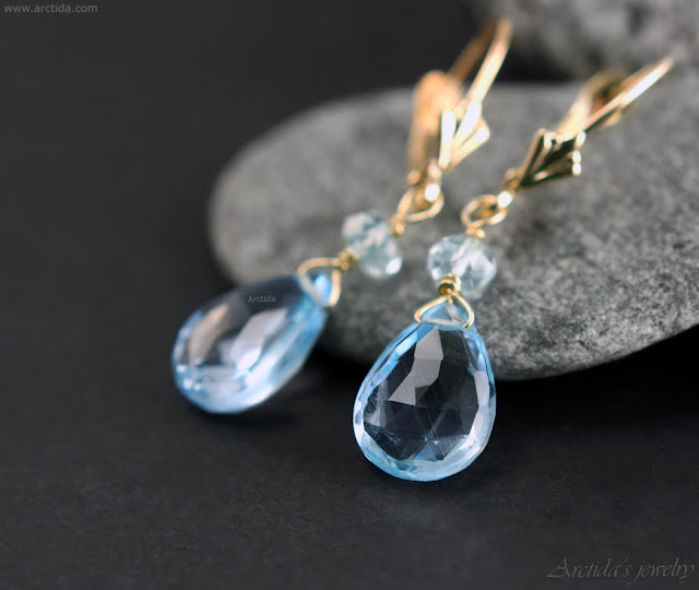 https://shop.arctida.com/en/home/123-aquamarine-sky-blue-topaz-earrings-14k-solid-gold-calypso.html