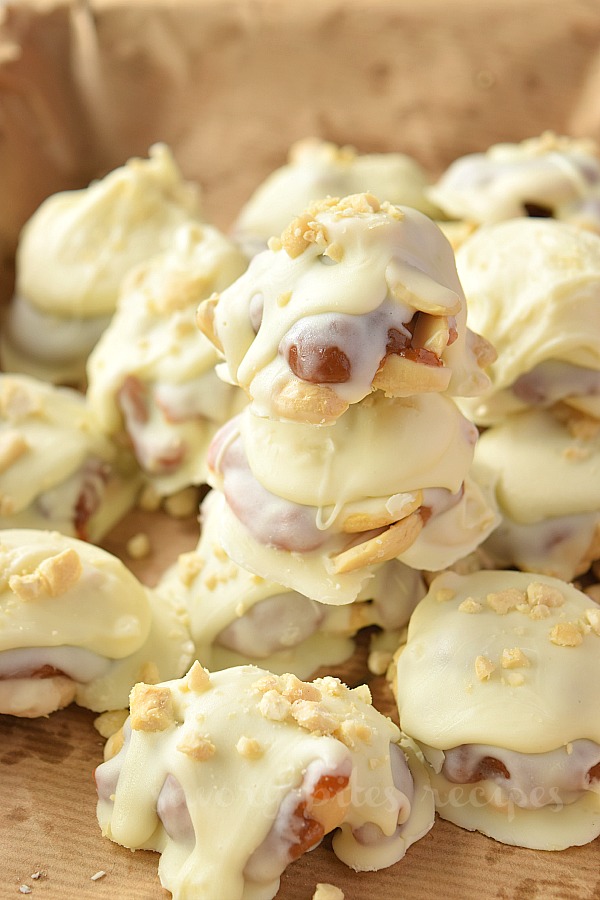 close up of caramel cashew clusters piled up