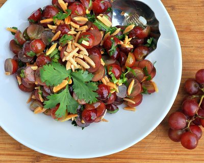 Grape Salad with Almonds & Cilantro ♥ KitchenParade.com, an unusual fruit salad (grapes, mango, apples, what else?!), savory and sweet at the same time, just-a-little-bit-different.