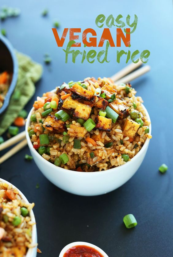 Easy, 10-ingredient vegan fried rice that's loaded with vegetables, crispy baked tofu, and tons of flavor! A healthy, satisfying plant-based side dish or entrée.