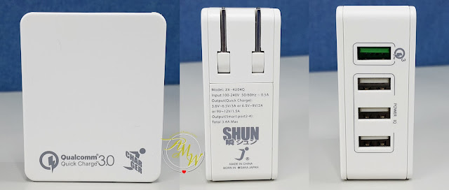 a photo of  SHUN 4-port charger with Qualcomm Quick Charge