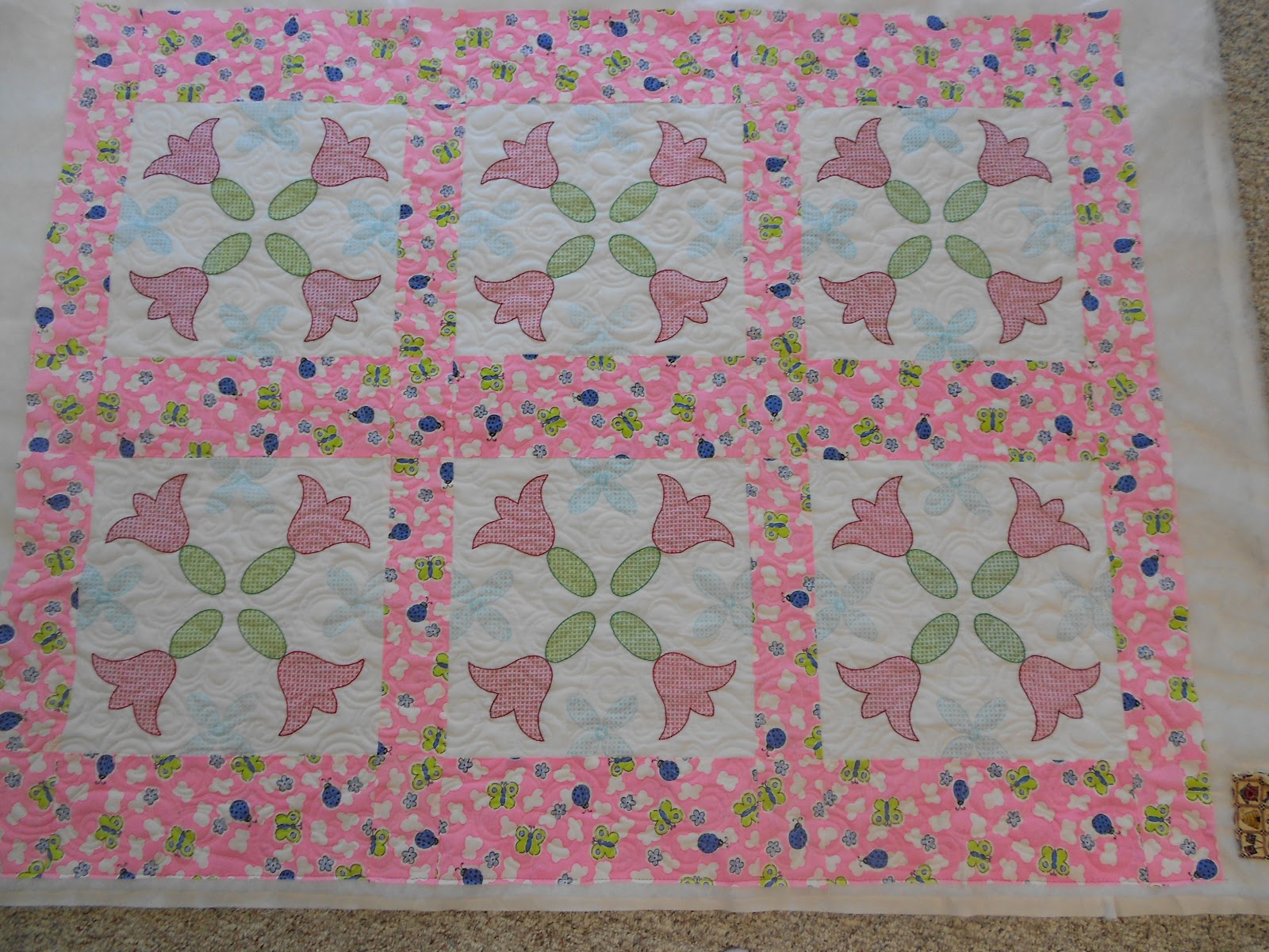 Down to sew an embroidered baby quilt and a win