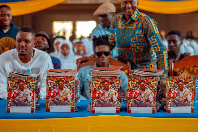 Strongman Donates Books To AMASS SHS