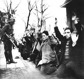Germans rounding up Jewish men in Amsterdam during World War II worldwartwo.filminspector.com