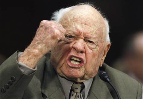 Angry Mickey Rooney speaking with raised fist