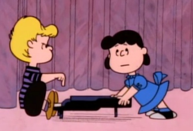 Lucy and Shroeder at the piano in A Charlie Brown Christmas 1965 animatedfilmreviews.blogspot.com