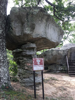 An image of a large lock at with a sign board below it