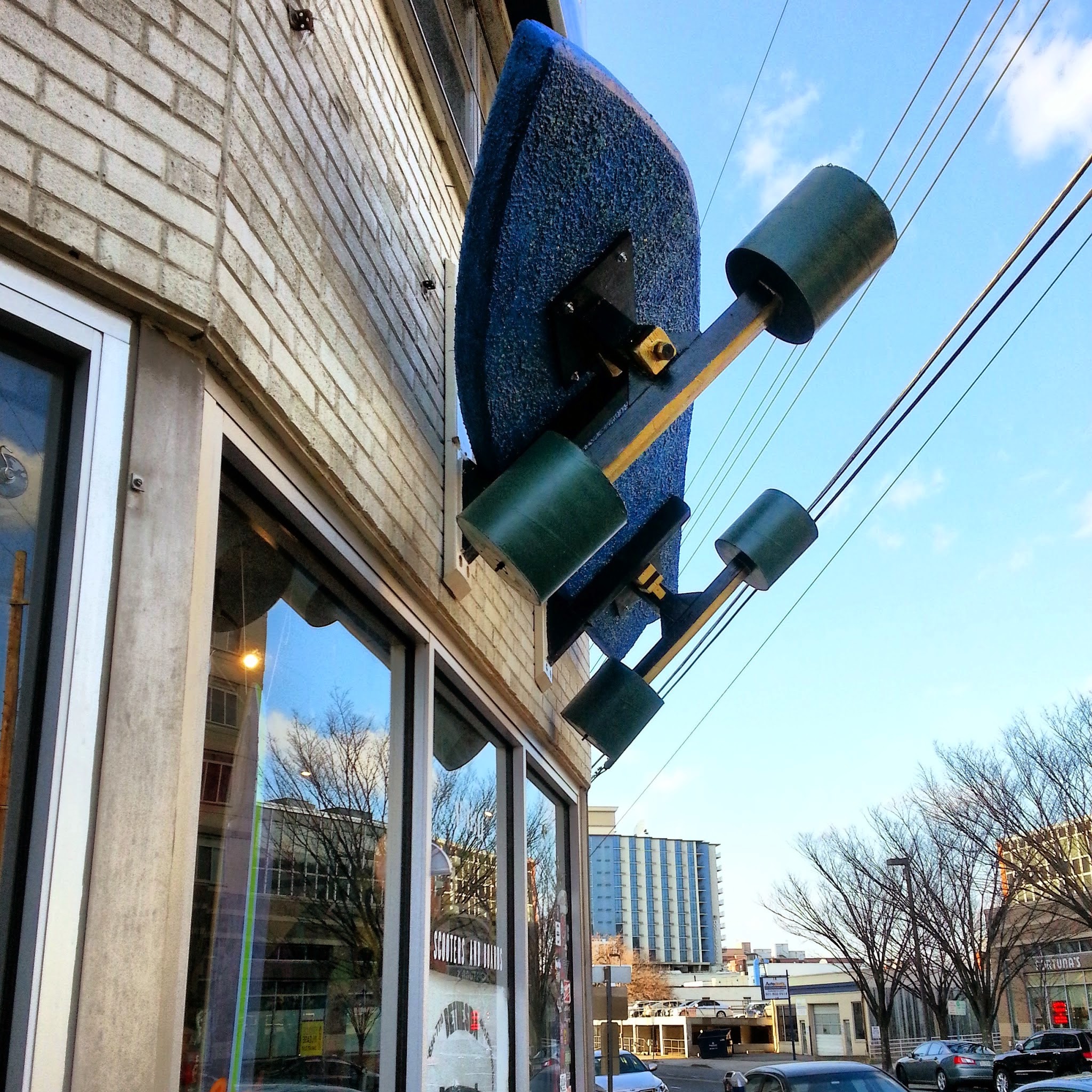 Robert Dyer Bethesda Row SKATE OR DIE! GIANT SKATEBOARD CATCHES AIR