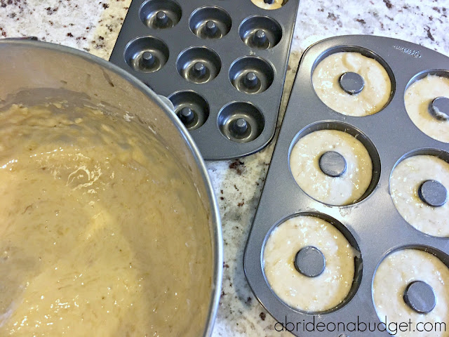 Doughnuts at weddings are so popular. Make your own with this Homemade Banana Doughnuts With Chocolate Shell Wedding Favors recipe from www.abrideonabudget.com.