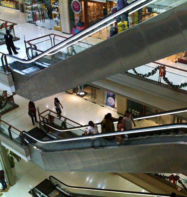 people on the escalators