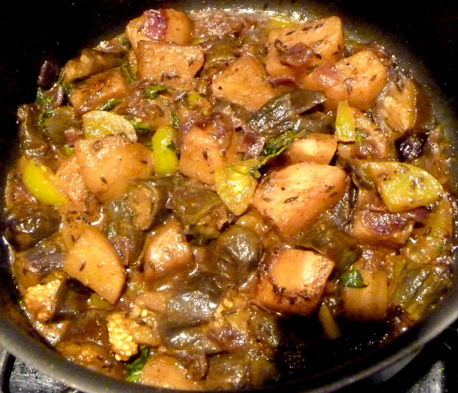 Vegan Stew infused with Eggplant Onion Potatoes Garlic Herbs and Tomatoes