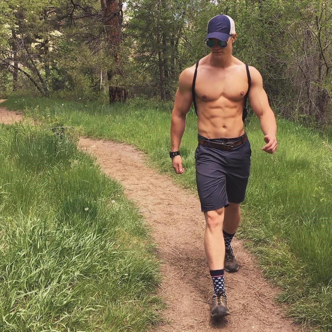 handsome-muscle-hunk-woods-walking-abs-cap-sunglasses