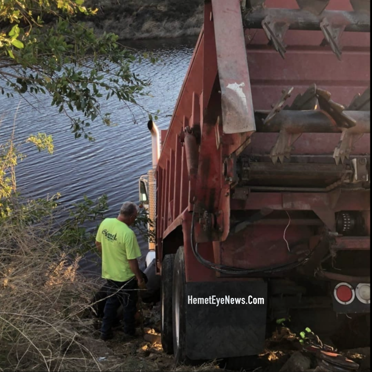 IDIOTS DRIVES SEMI DUMP TRUCK INTO LAKE AS A PRANK. GILMAN SPRINGS