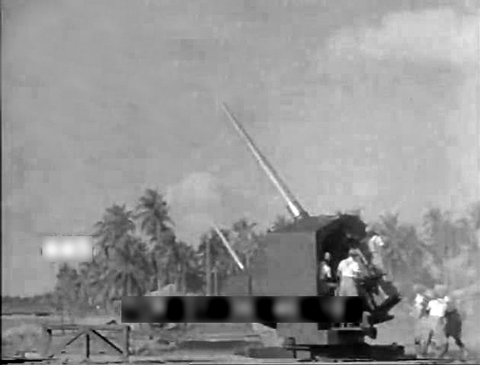 practice firing of coastal gun at Singapore ca 1941 worldwartwo.filminspector.com