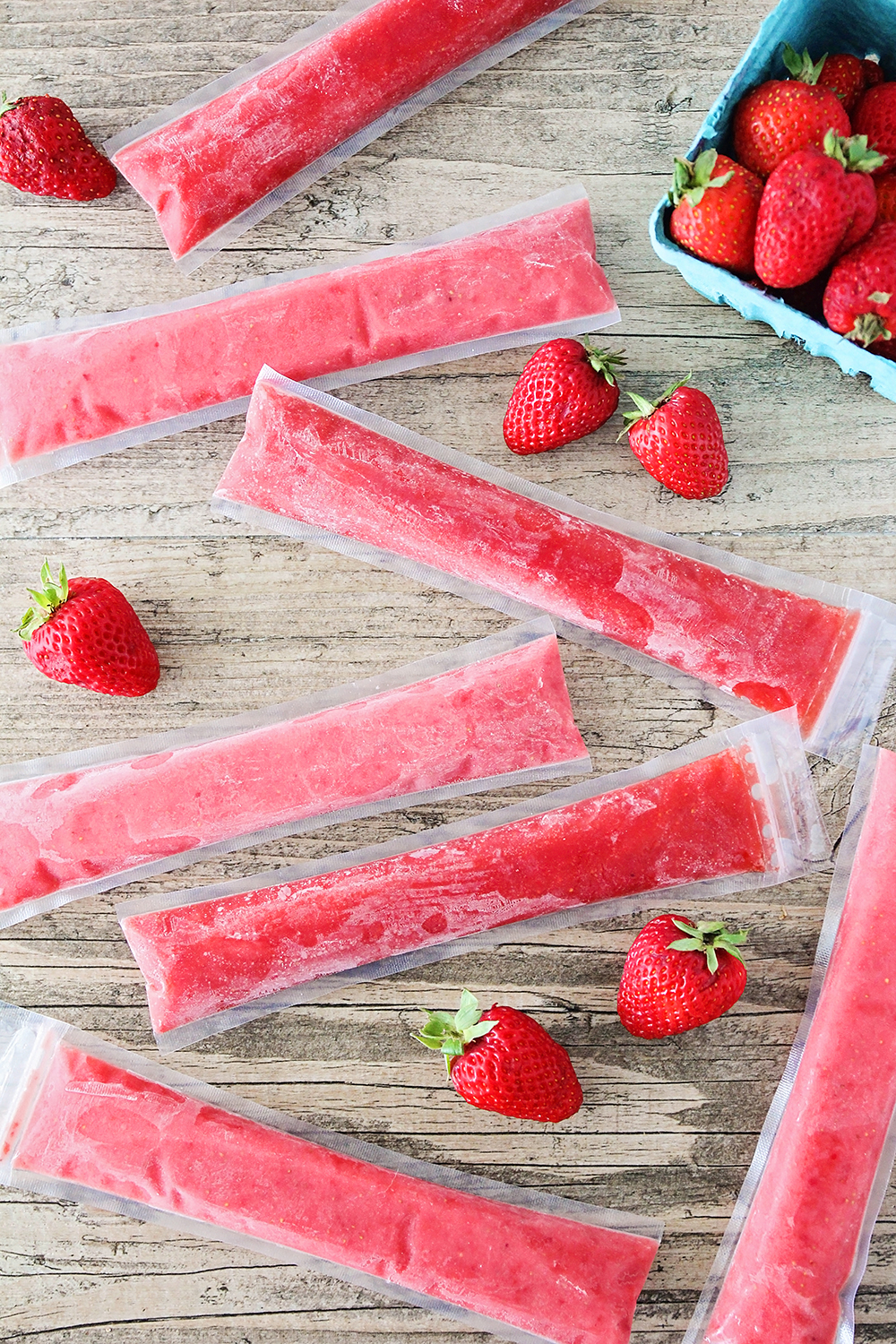 These healthy and delicious strawberry freezer pops have only three ingredients, and are full of strawberry flavor. They're so simple to make, and the kids will love them!