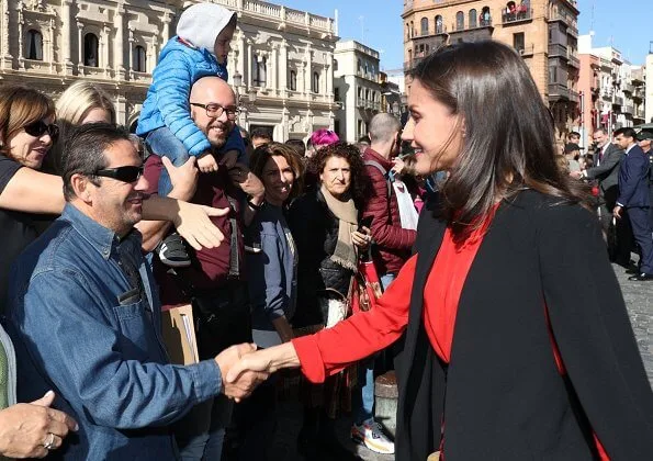 Queen Letizia wore Zara cape style jacket in black and Hugo Boss Banora gathered silk blouse and black floral skirt