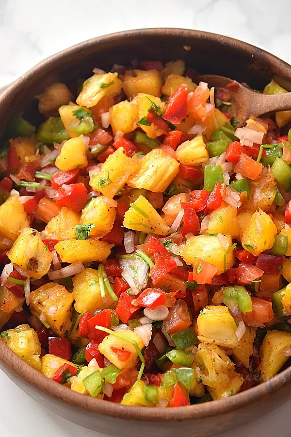a bowl of spicy and sweet pineapple jalapeno salsa