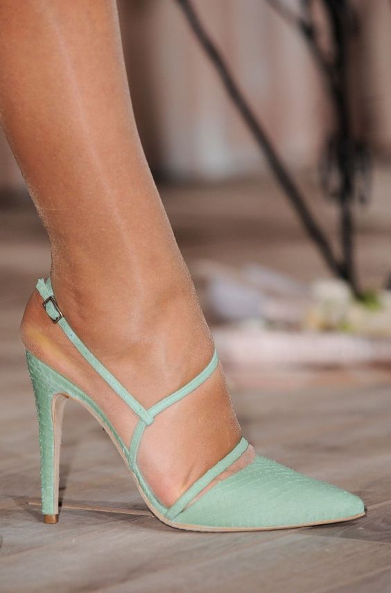 Green heels withh ankle straps and nude tights