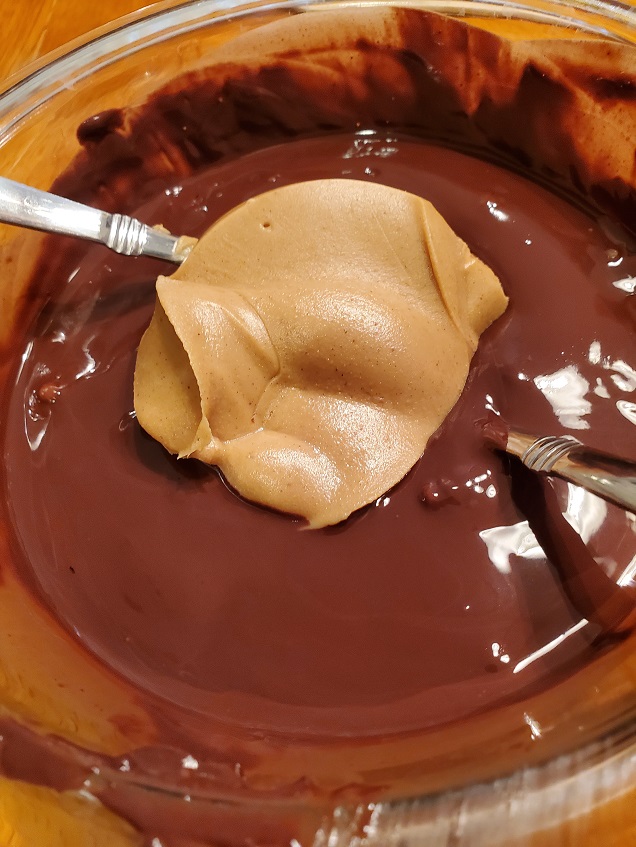 this is mixing in a bowl peanut butter and melted chocolate