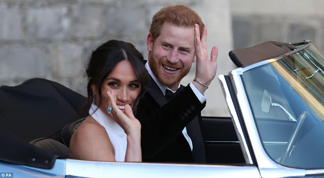 Meghan Markle is stunning in her second dress as she and her new husband head to their wedding reception (photos)
