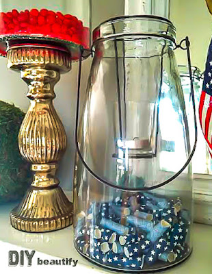 Create a 4th of July Mantel on the cheap by borrowing items from around your home! See it all at DIY beautify
